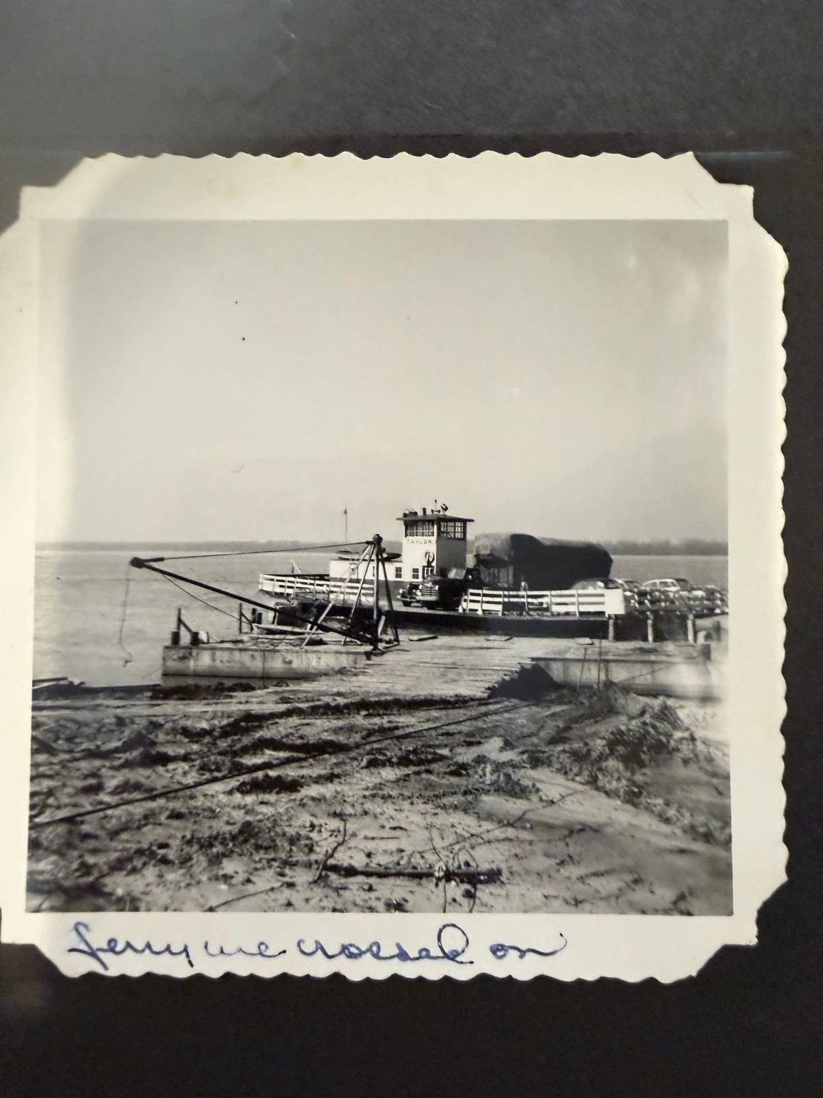 A vehicle ferry at a river landing, with the handwritten caption “Ferry we crossed on.”
