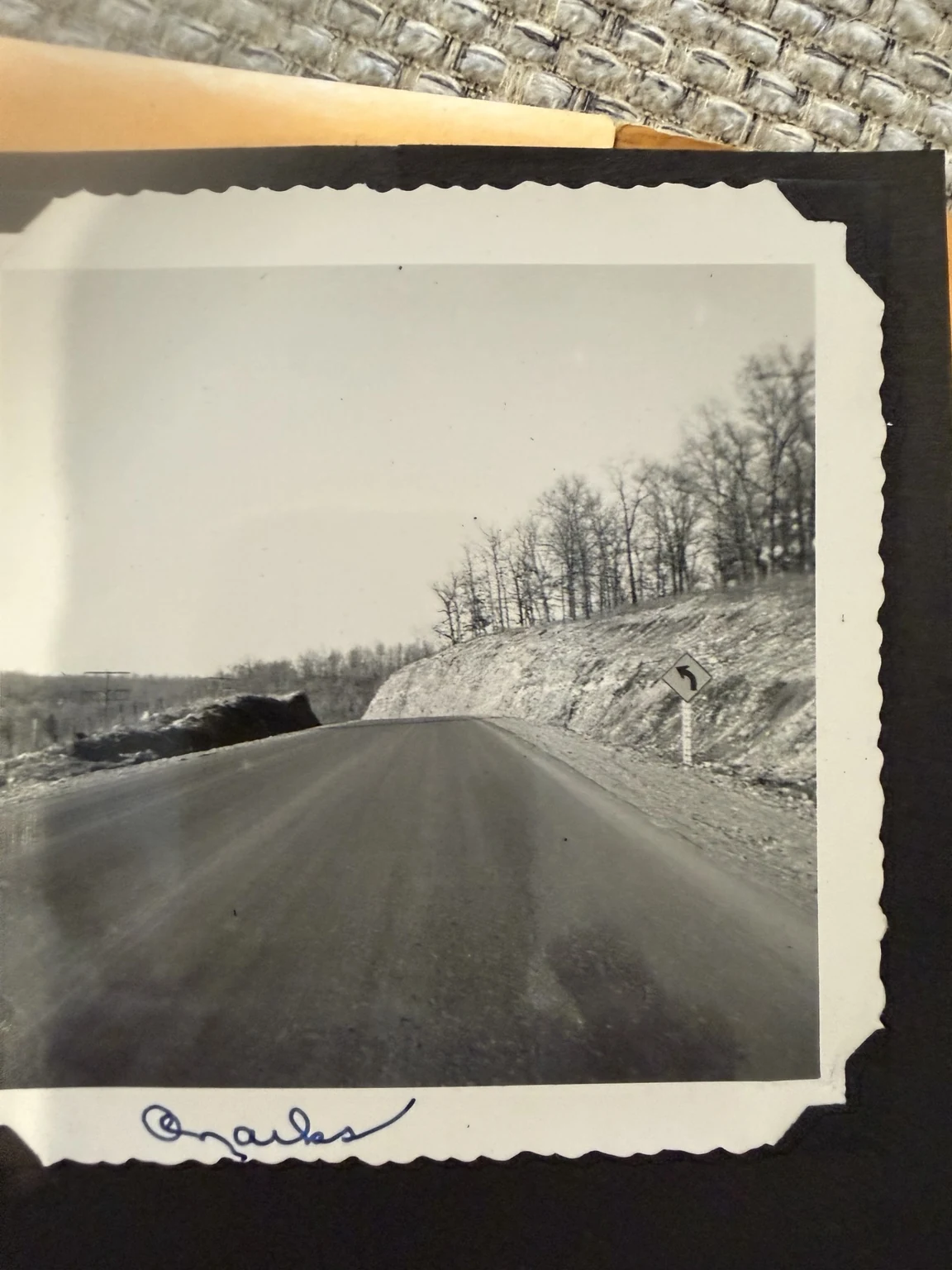 “Ozarks” (original caption). A road beside a rock cut. Exact route and date are unconfirmed.